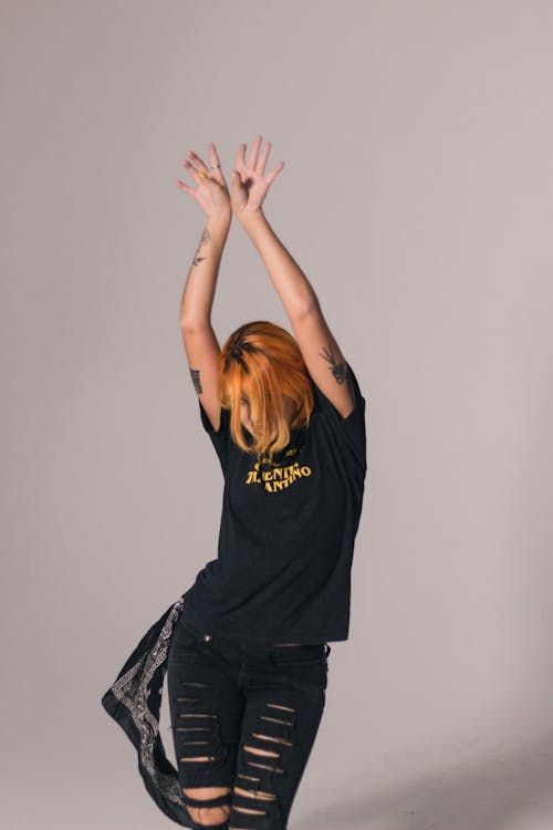Free Woman in Black Shirt Dancing Stock Photo