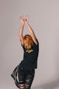 Woman in Black Shirt Dancing