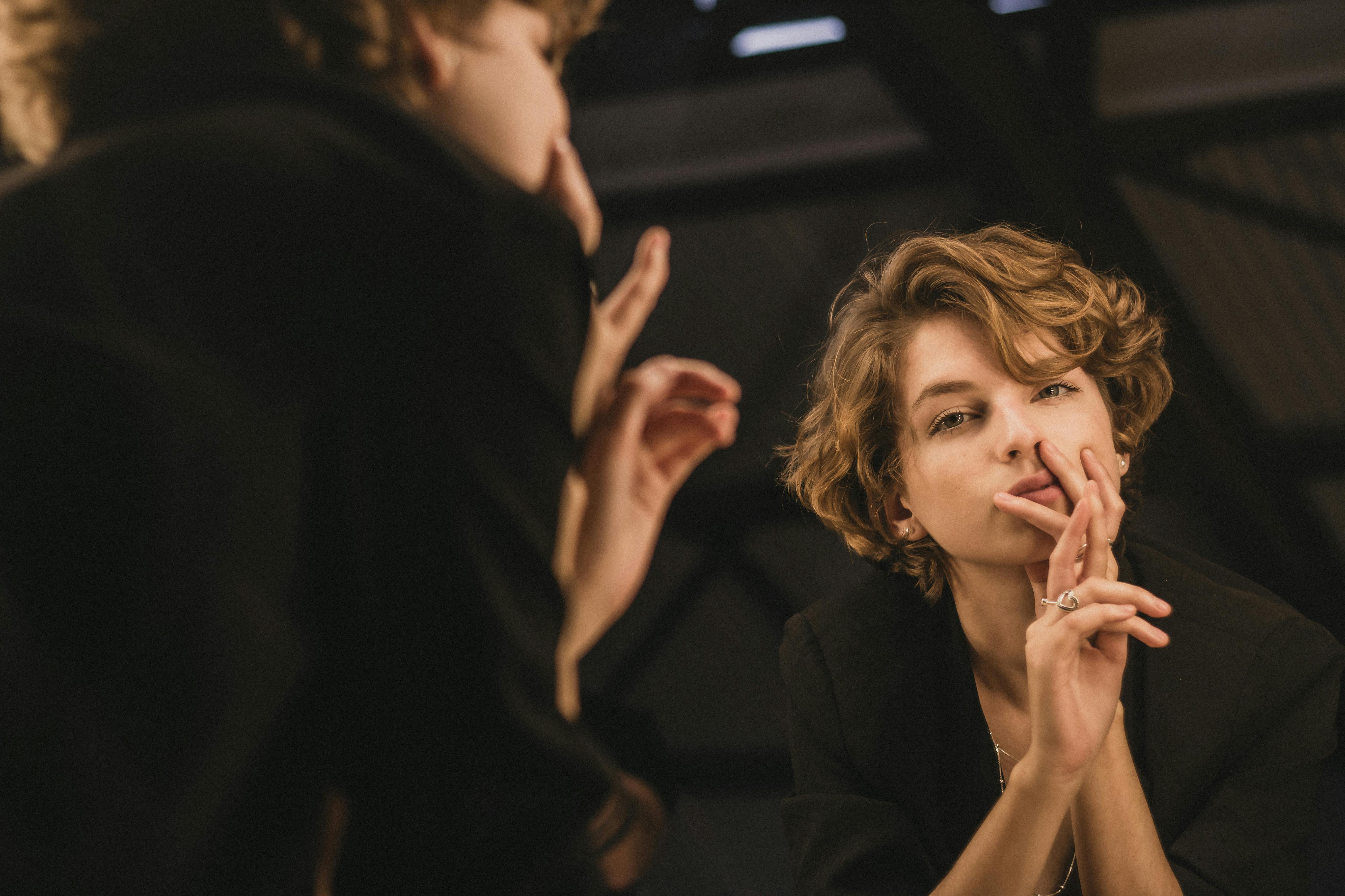 Shallow Focus Photography of Woman Holding her Chin Wearing a Black Top ...