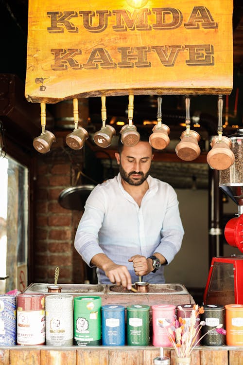 A man standing in front of a coffee shop