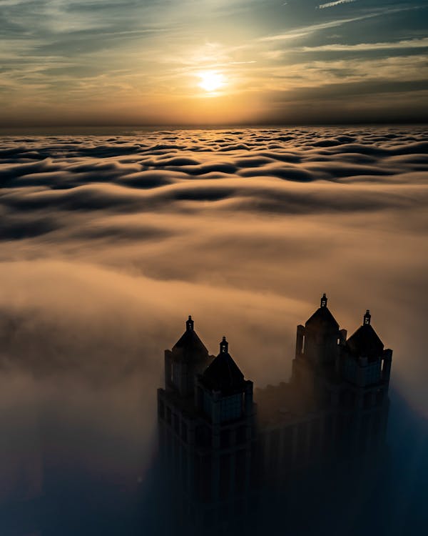 Free Castle on Top of the Mountain With Sea of Clouds Stock Photo
