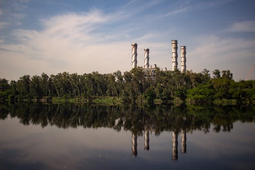 Industrial Plant With Reflection Om Body Of Water