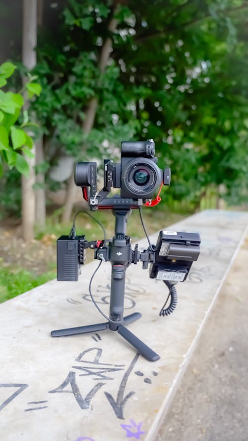 A camera tripod with a camera attached to it