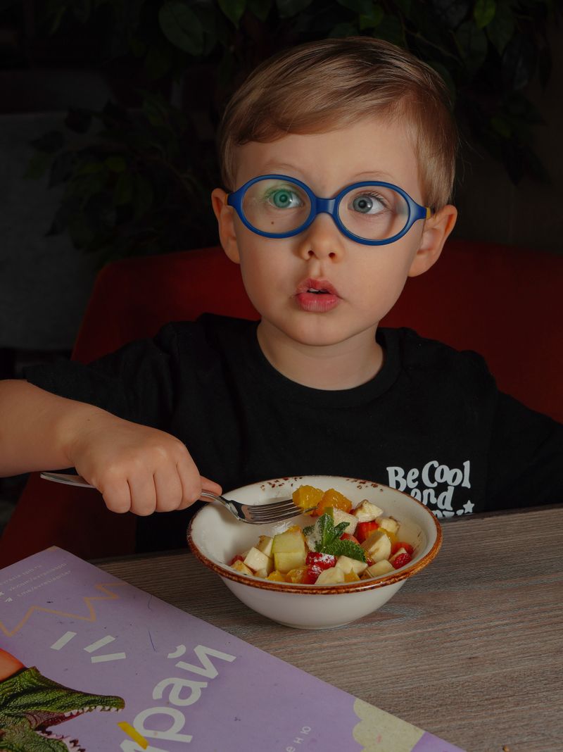 Child wearing new glasses smiling