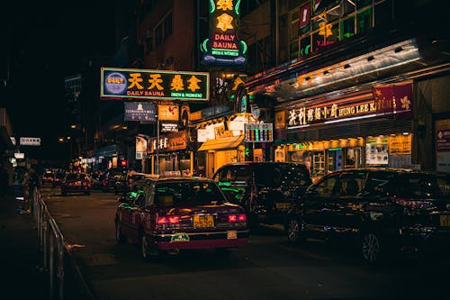 Cars Beside Neon Signages