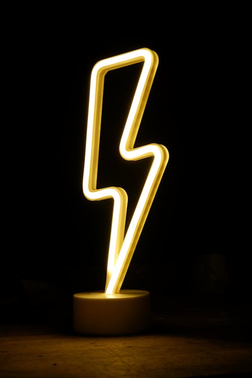 A neon light that has a lightning bolt on it