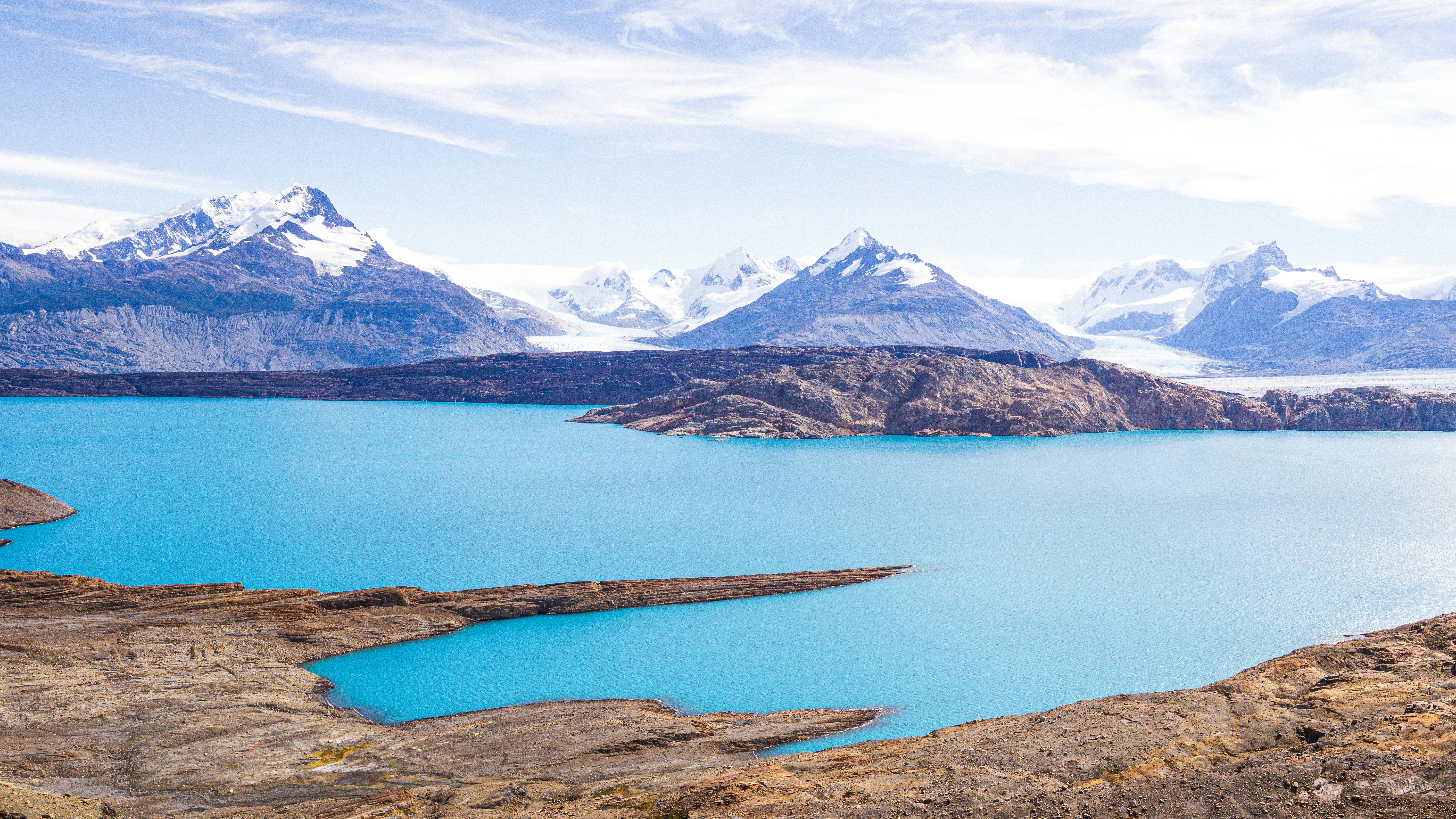 Explore the stunning landscape of Upsala Glacier in Patagonia, featuring majestic mountains and turquoise waters.