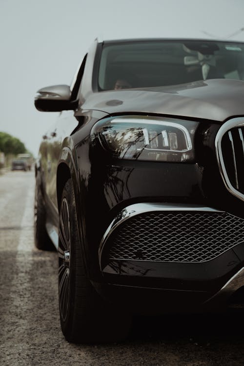 The front end of a black mercedes suv