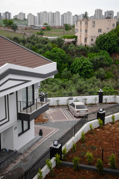 A house with a car parked in front of it