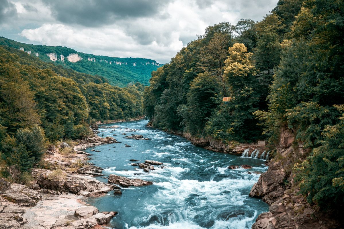 River Surrounded By Rocks Rocks in a River · Free Stock Photo