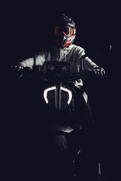 A man in a helmet riding a motorcycle