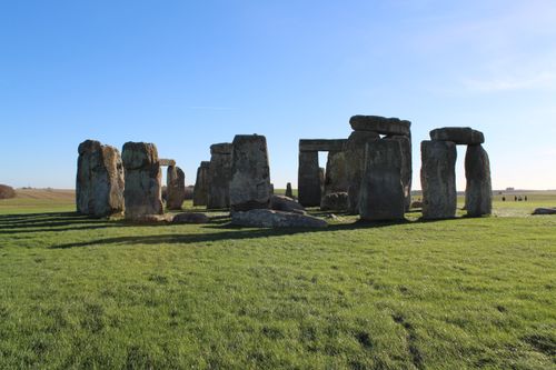 Free A stunning view of Stonehenge's megalithic stones on a sunny day with clear blue skies. Stock Photo