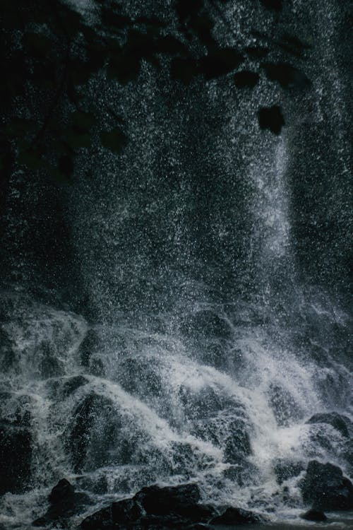 A black and white photo of a waterfall