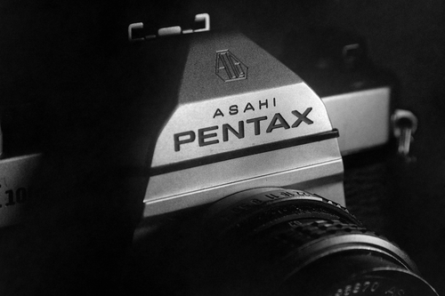 Free Monochrome close-up of a classic Asahi Pentax camera showcasing vintage photography equipment. Stock Photo