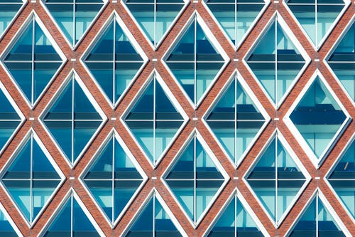 A close up of a building with a pattern of triangles