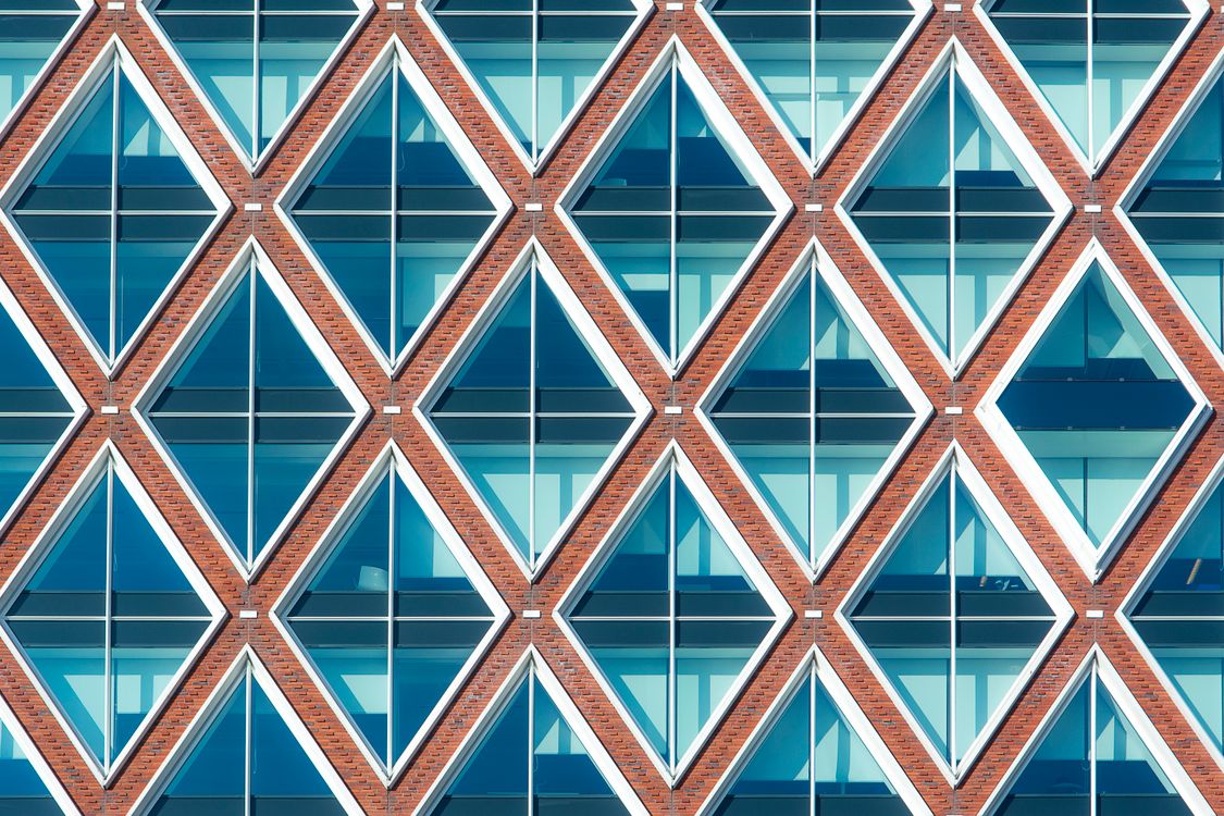 Triangle Pattern Building A close up of a building with a pattern of triangles · Free Stock Photo