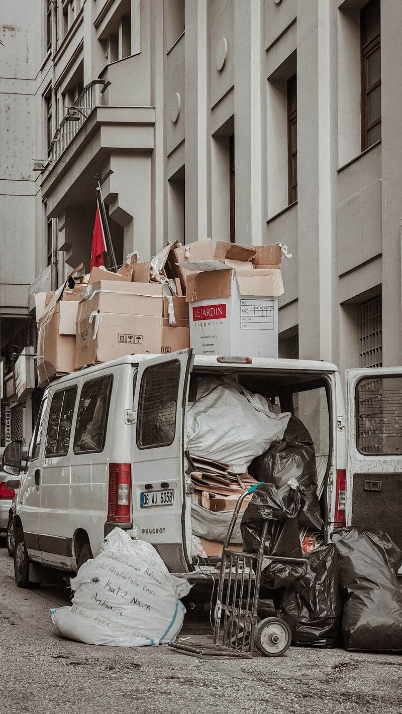 Junk removal van loaded with cardboard boxes for a scheduled pickup booked through Google Ads for junk removal