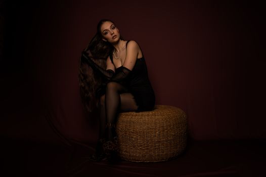 Woman Posing in Black Dress in Shadow 
