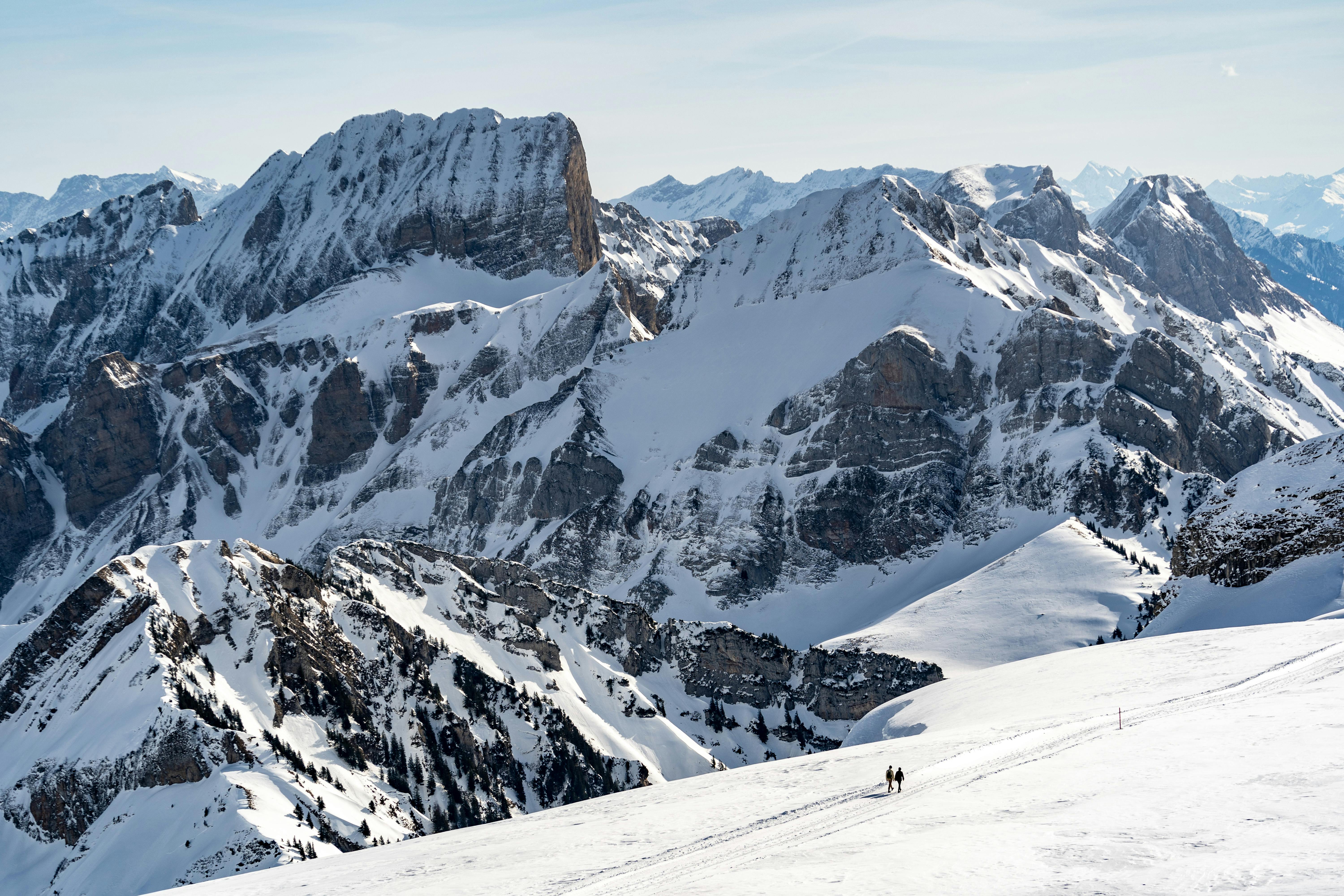 A stunning winter landscape of snow-covered peaks in Appenzell, Switzerland.
