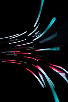 Dynamic neon-lit geometric structures in a modern Berlin setting.