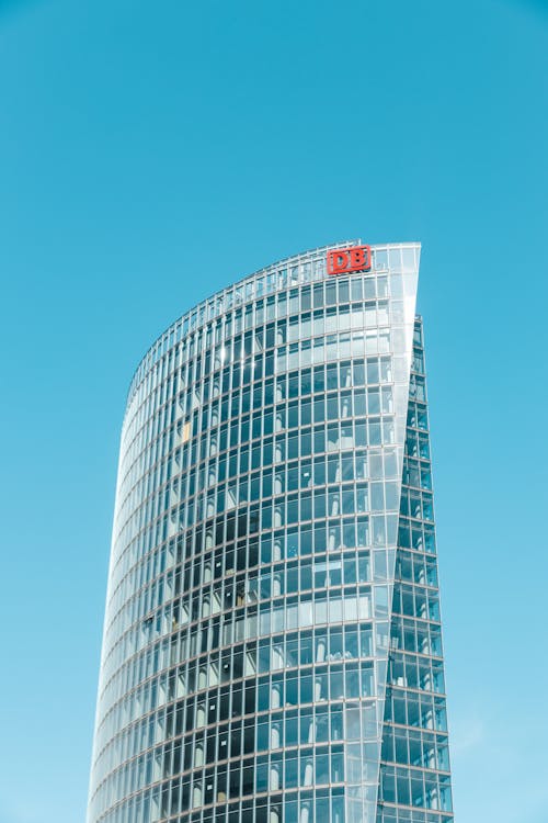 A tall building with a red and white sign