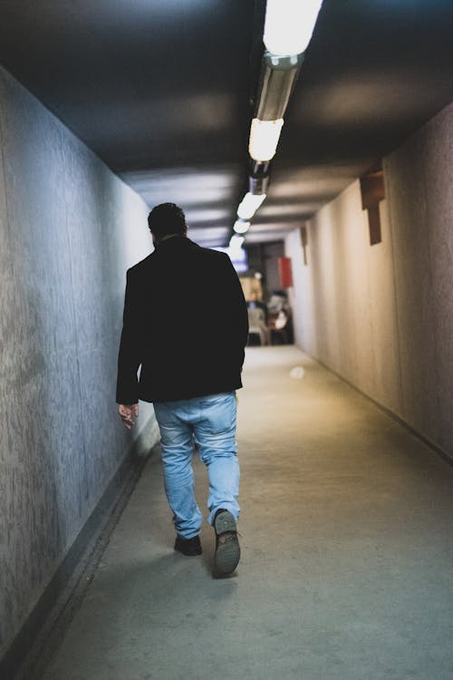 Man Walking in Tunnel
