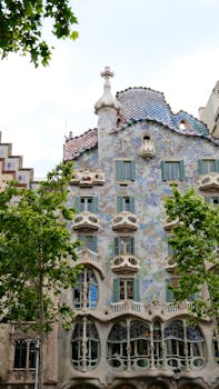 Explore the vibrant facade of Casa Batlló, a masterpiece of modernism architecture in Barcelona, Spain.