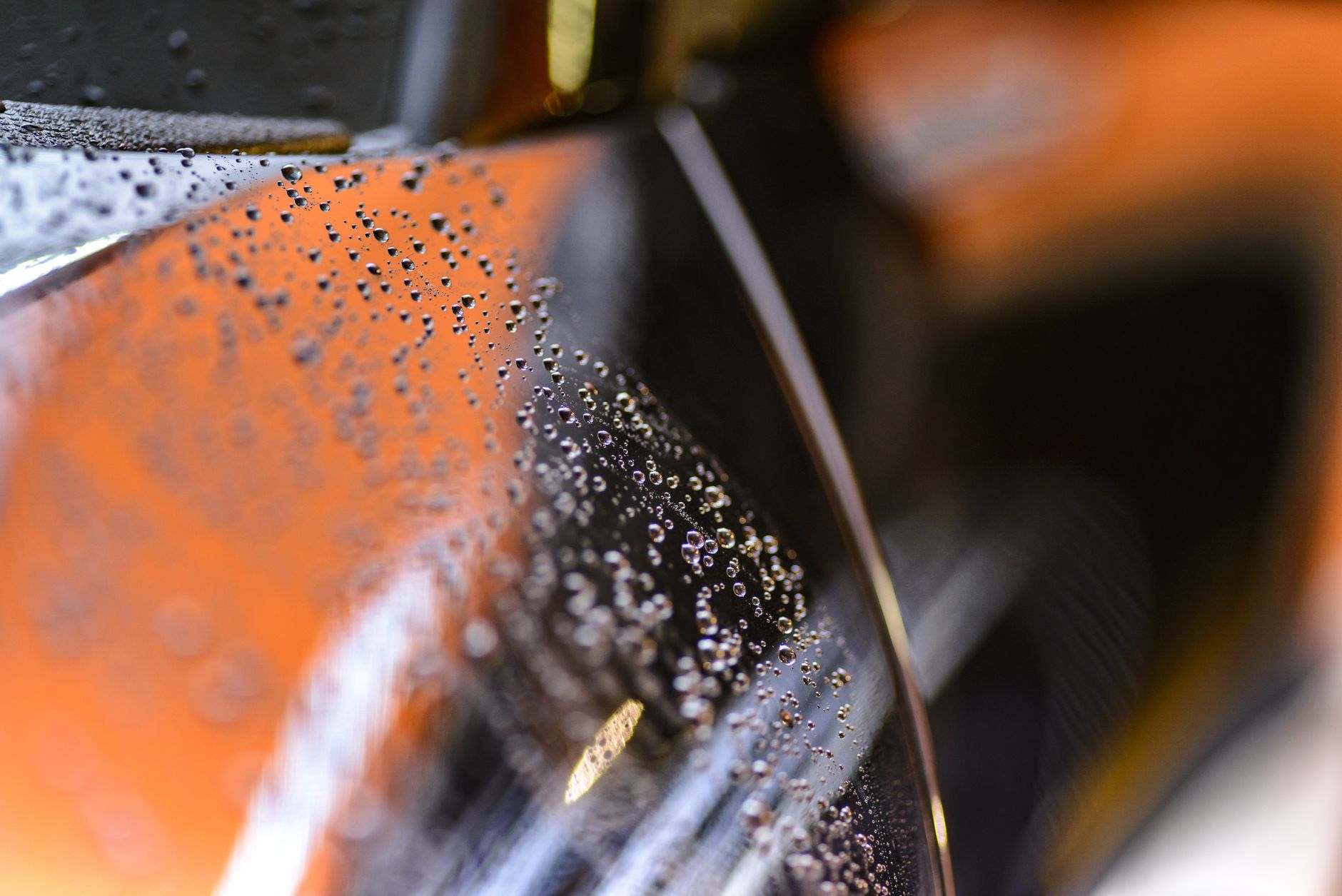 Water beading on a glossy ceramic-coated surface