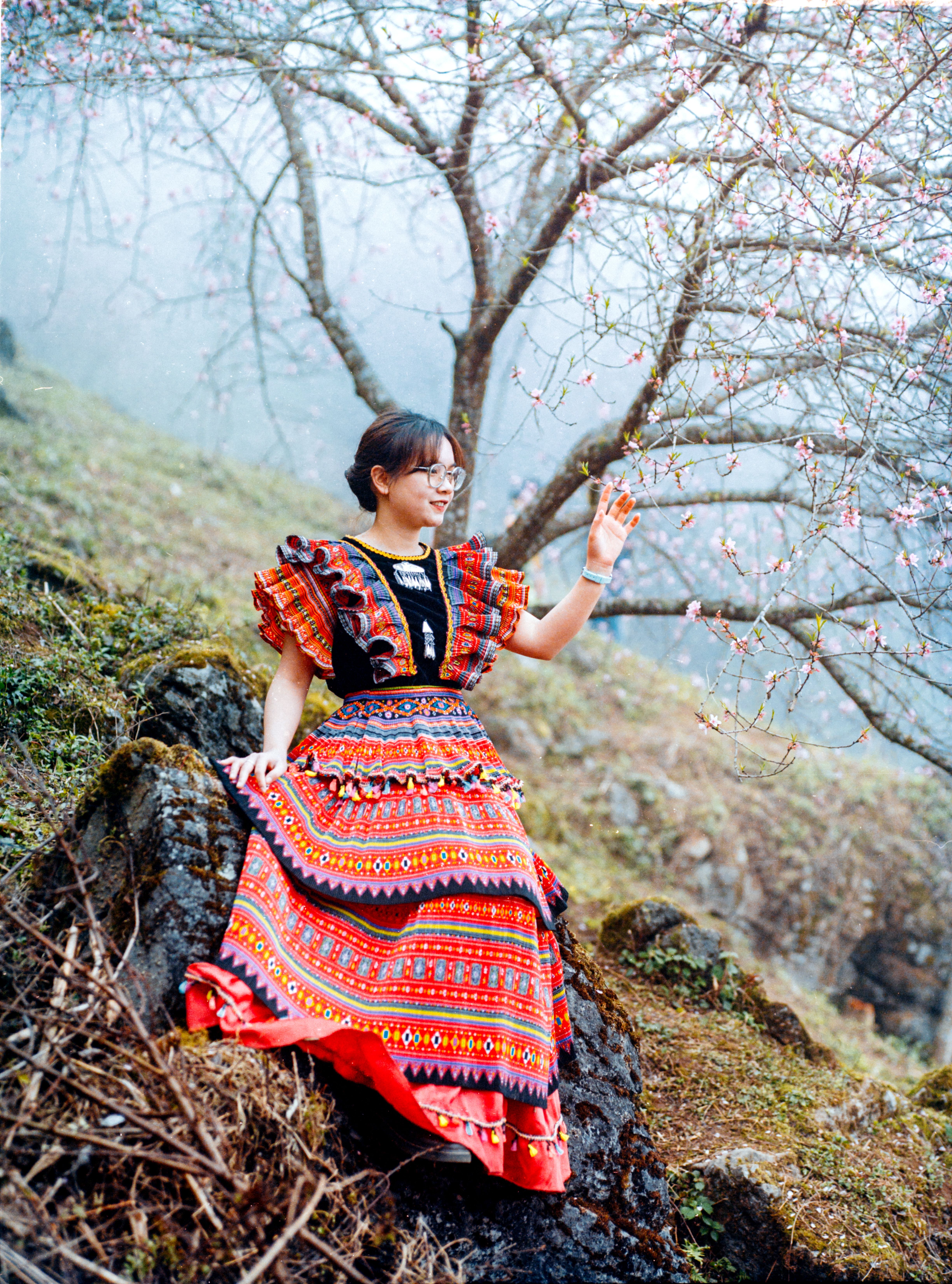 Woman in Dress Sitting on Rock · Free Stock Photo