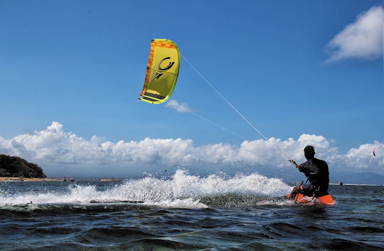 Man Surfing On The Beach