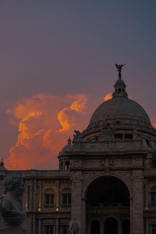Free Stunning view of Victoria Memorial in Kolkata at sunset, highlighting its majestic architecture against vibrant clouds. Stock Photo