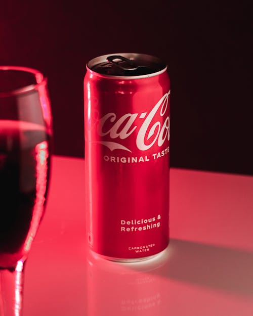 A can of coke and a glass of wine