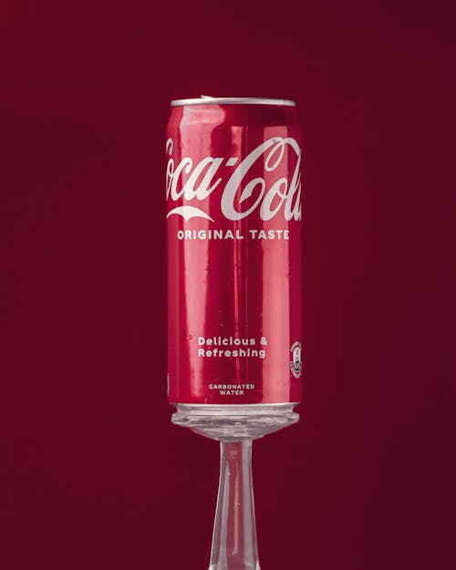 A can of coke on a wine glass