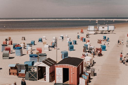 Colorful beach cabins on the sandy shores of Borkum, Germany.