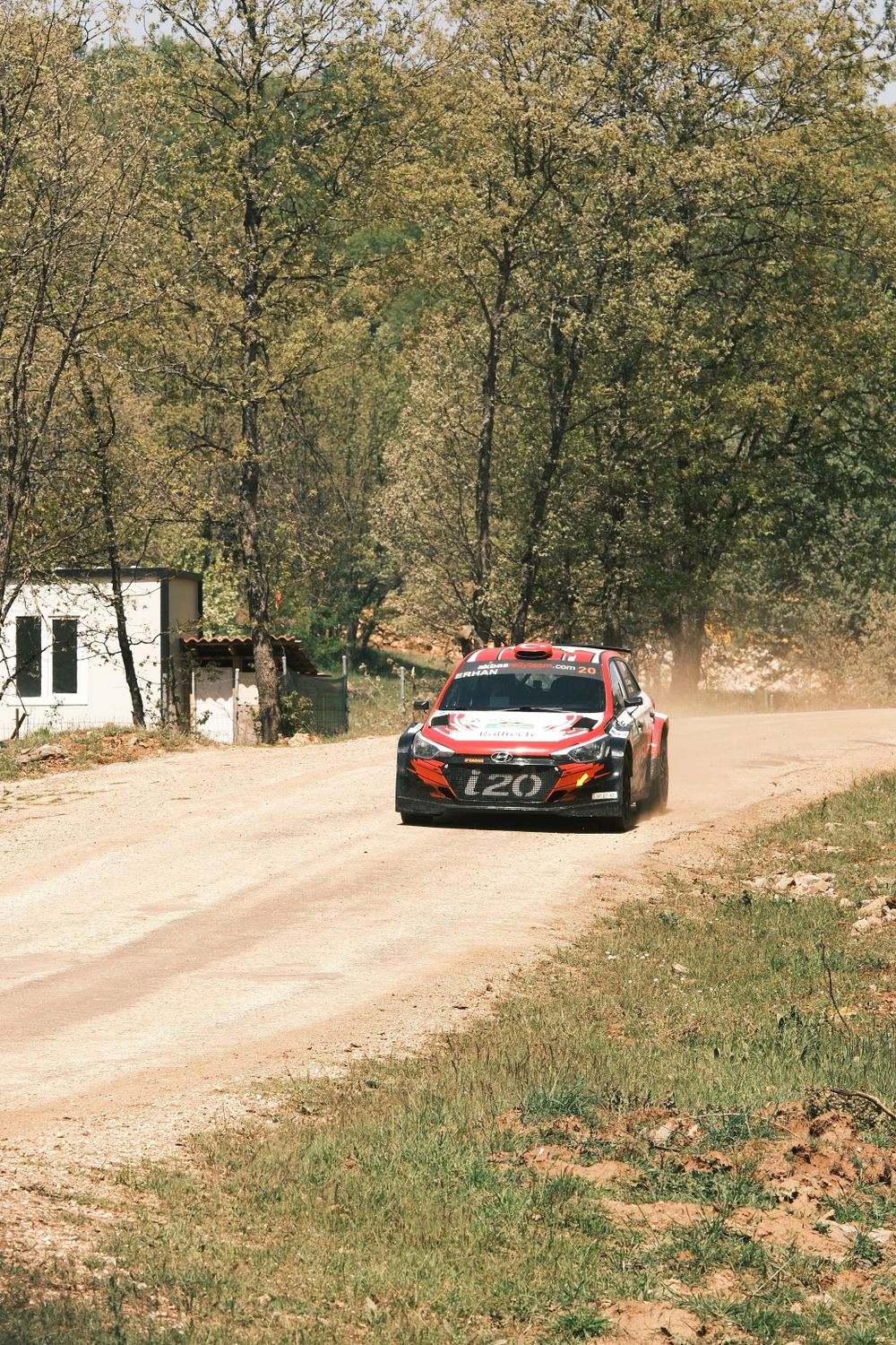 Aggressive Rally Driving A rally car driving down a dirt road · Free Stock Photo