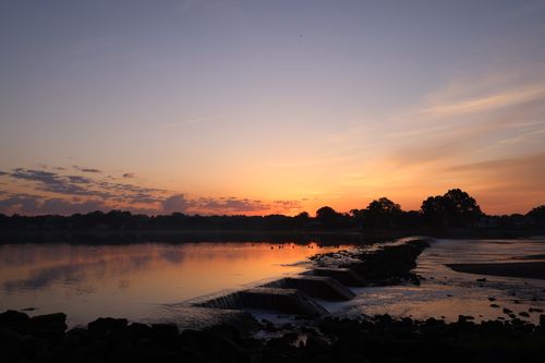 Free Peaceful sunset over a Stamford river with stunning reflections. Stock Photo