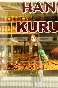 A vibrant bakery storefront showcasing an assortment of breads and desserts. Perfect urban culinary scene.