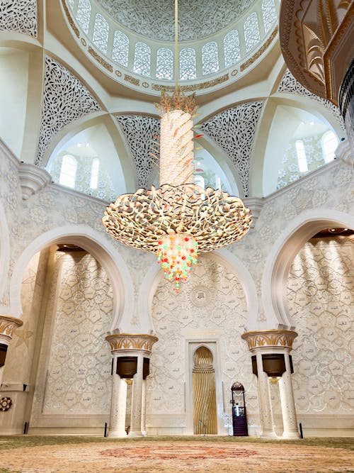 The interior of a mosque with a chandelier