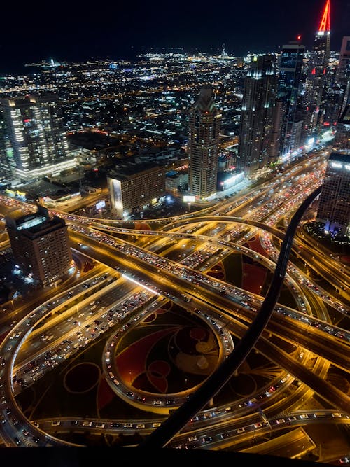 A city at night with traffic lights and highways