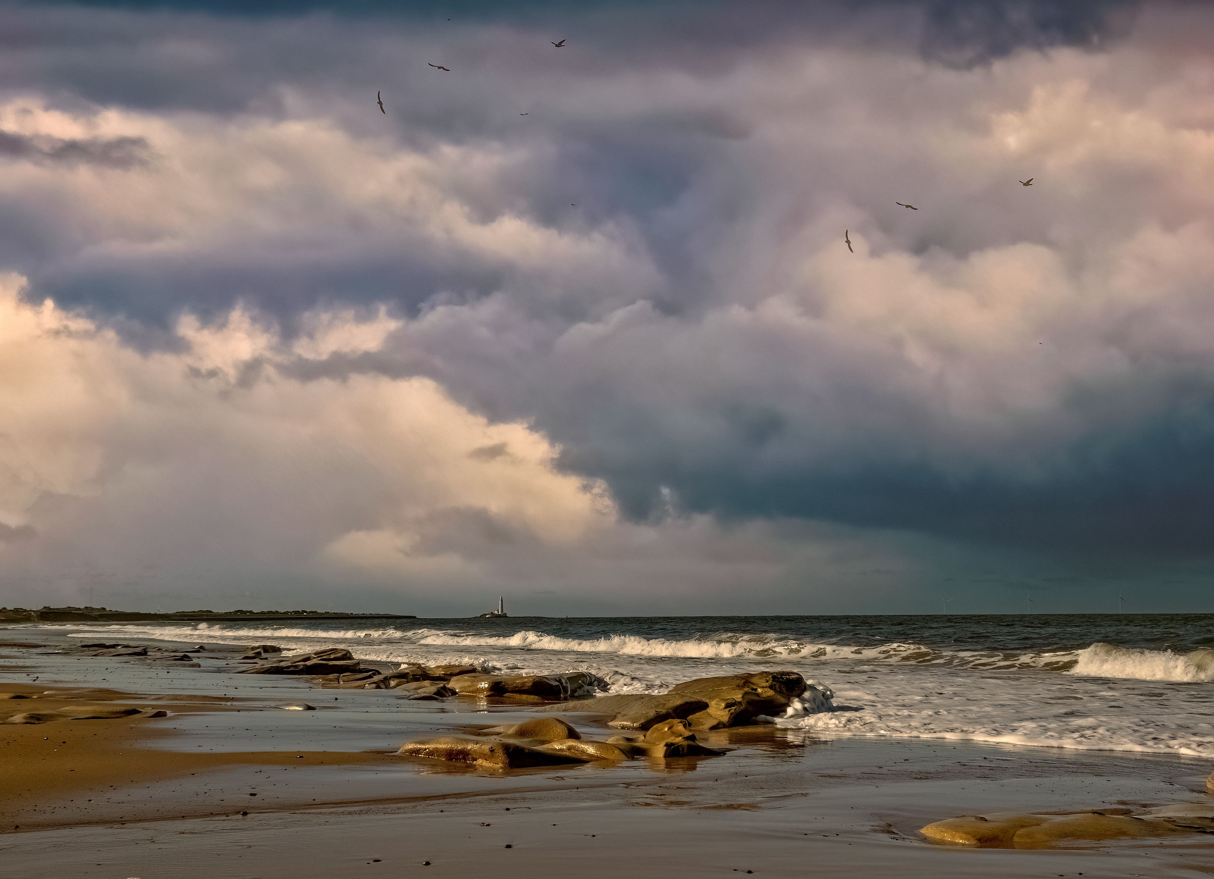 Clouds Above Rocky Beach · Free Stock Photo