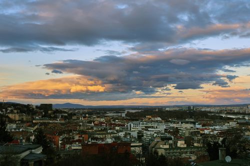 Free Breathtaking view of Budapest cityscape under a dramatic sunset sky. Stock Photo