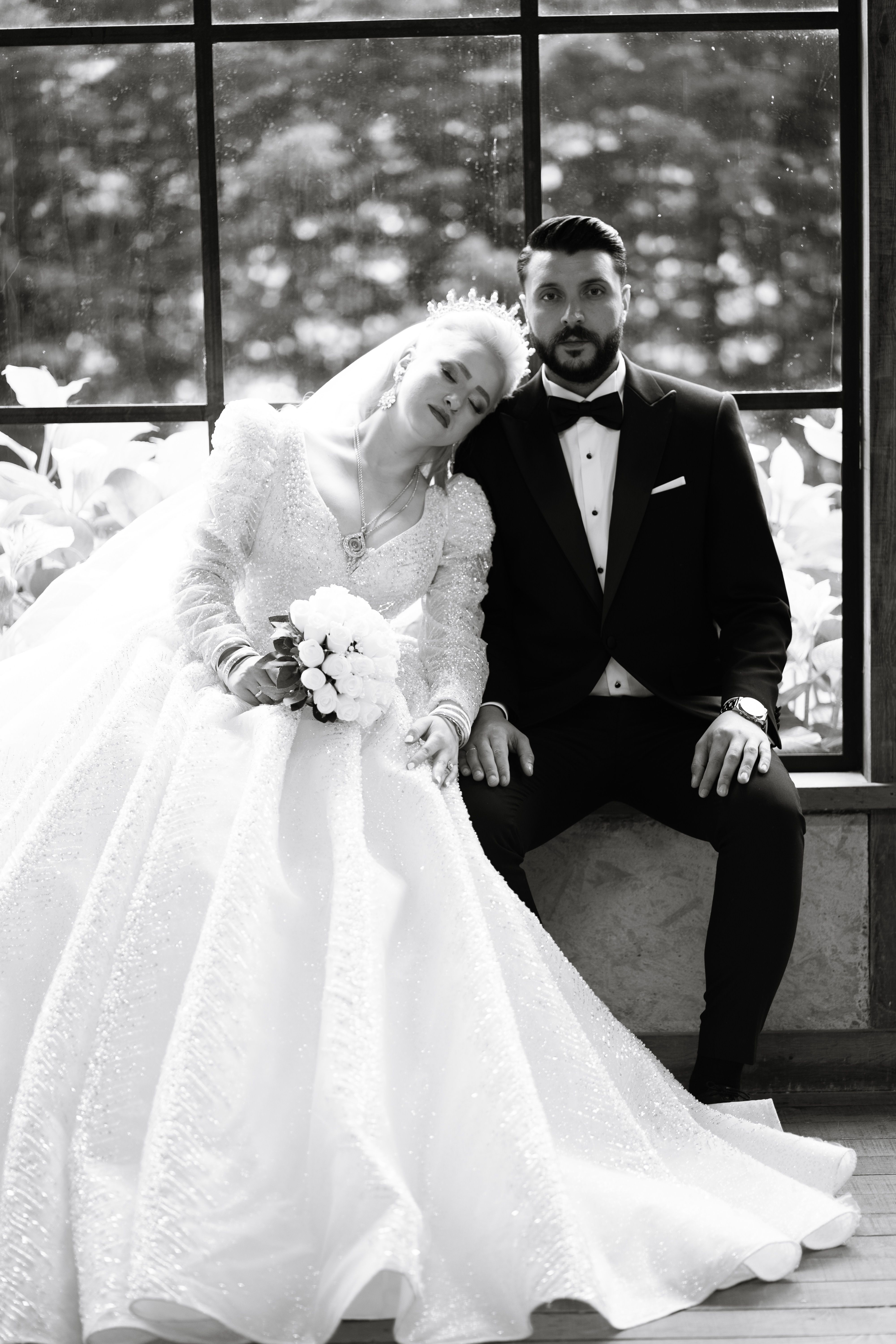 Newlywed Couple Sitting in Black and White · Free Stock Photo
