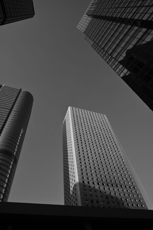 Free Imposing skyscrapers in Hong Kong's business district captured in black and white, showcasing modern architecture. Stock Photo