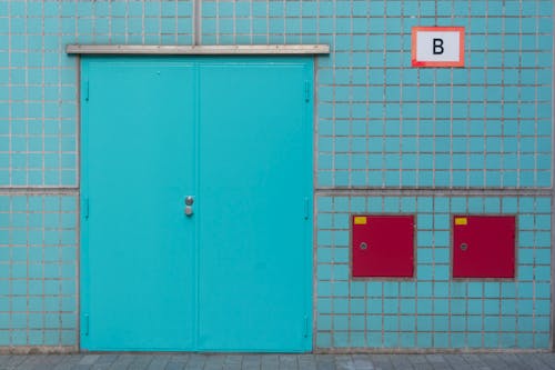 A blue door with two red numbers on it