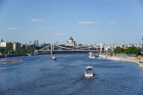 Free Beautiful summer view of Moscow River with bridge, boats, and Cathedral of Christ the Saviour. Stock Photo
