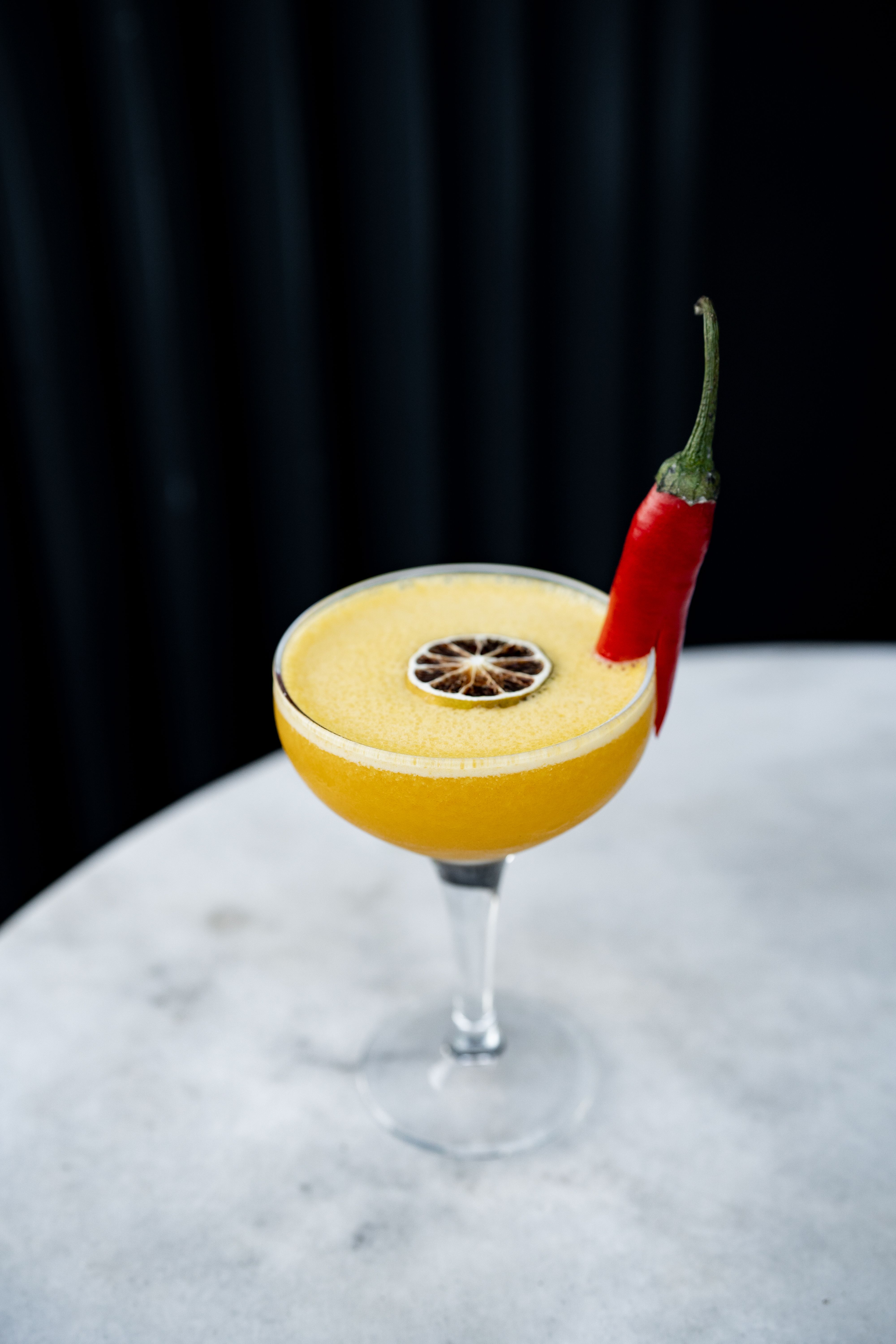 A cocktail with a chili pepper on top · Free Stock Photo