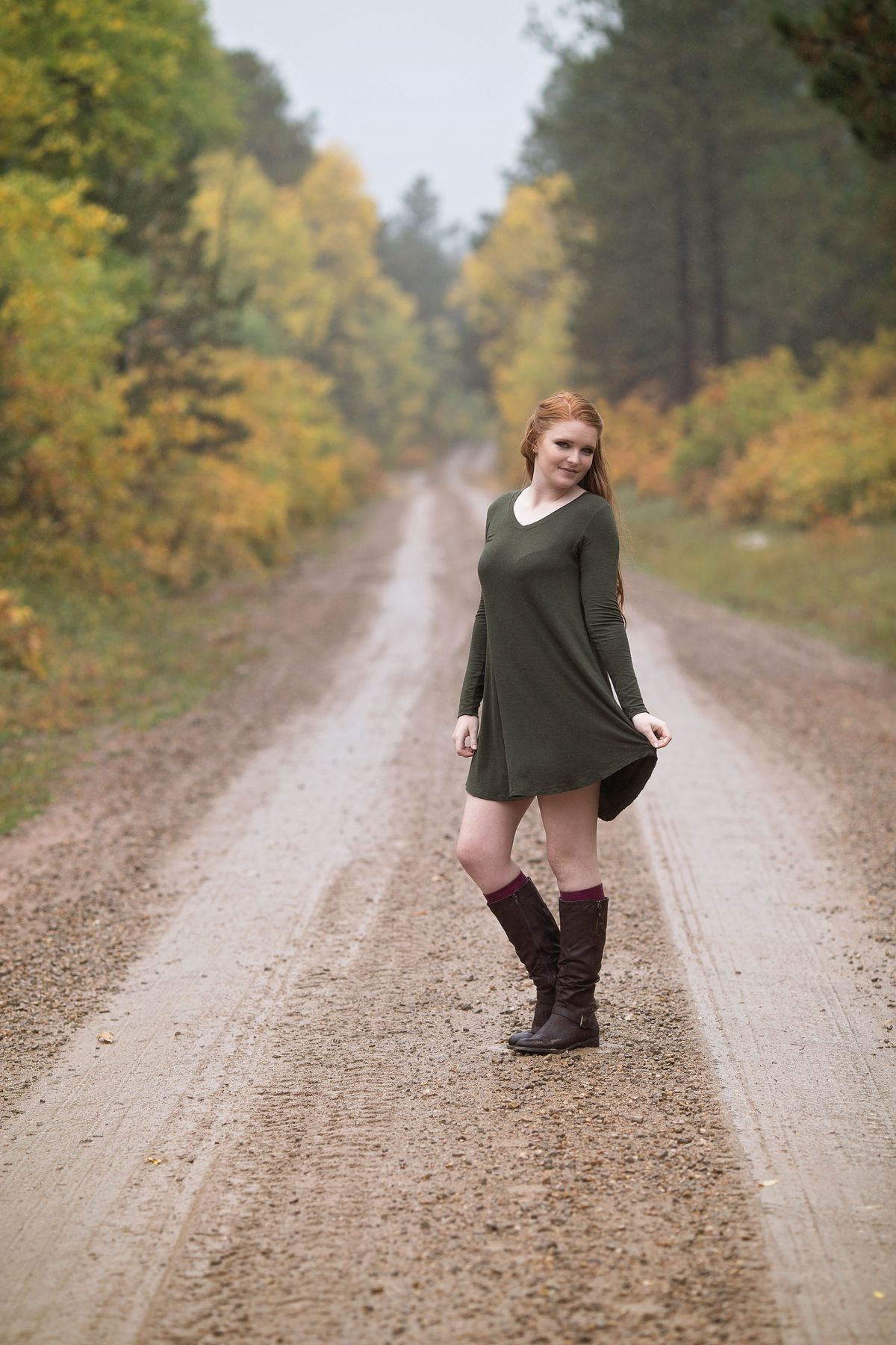 Equestrian Outfits for Women — 7 Riding Boots and Heritage Looks for Fall Woman in riding boots and a knit dress in autumn