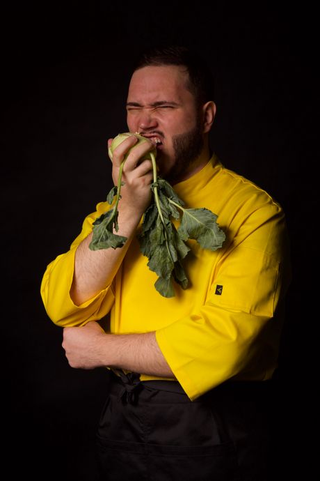 Chef biting into a fresh turnip outdoors — photo by Monleo Yellow Chef on Pexels