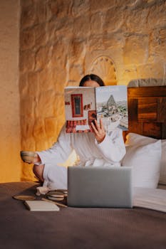 A woman enjoys a serene morning in a Cappadocia hotel, reading and relaxing.