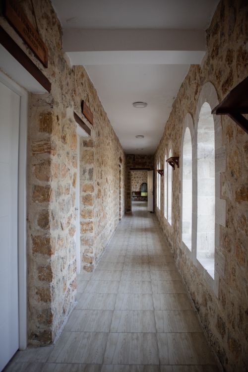 Free Explore a stone corridor with arched windows in Palu, Türkiye, showcasing traditional Turkish architecture. Stock Photo